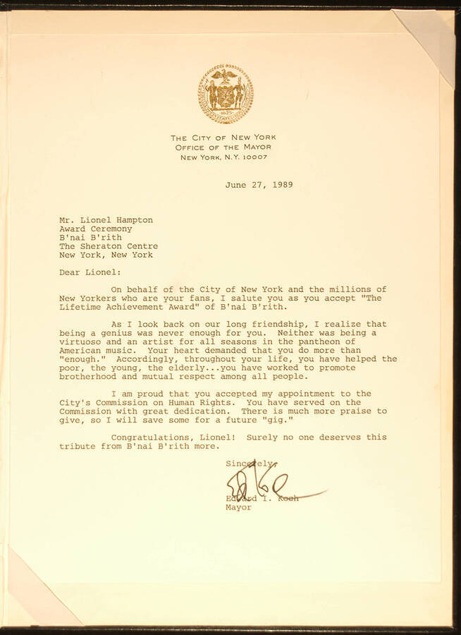 Letter.  12"x9" Blue folder holding a letter Letter from Edward I. Koch, Mayor of the City of New York, to Lionel Hampton congratulating him for the Lifetime Achievement Award of B'nai B'rith. Dated June 27, 1989