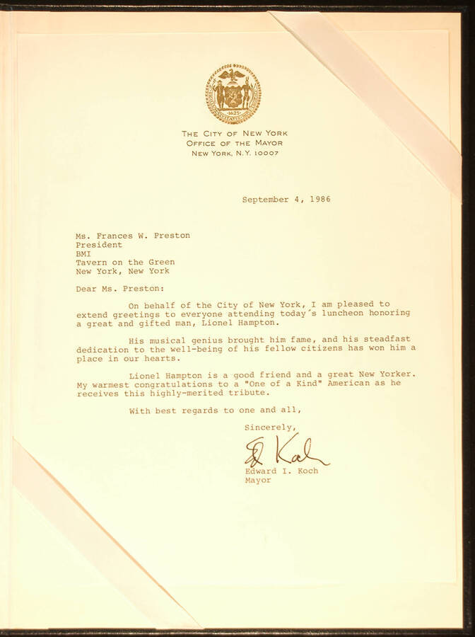 Letter.  12"x9" Blue folder holding a letter Letter from Edward I. Koch, Mayor of the City of New York, to Frances W. Preston, BMI President, greeting everyone attending the luncheon at the Tavern of the Green honoring Lionel Hampton as he receives the "One of a Kind" award. Dated Sep. 4, 1986