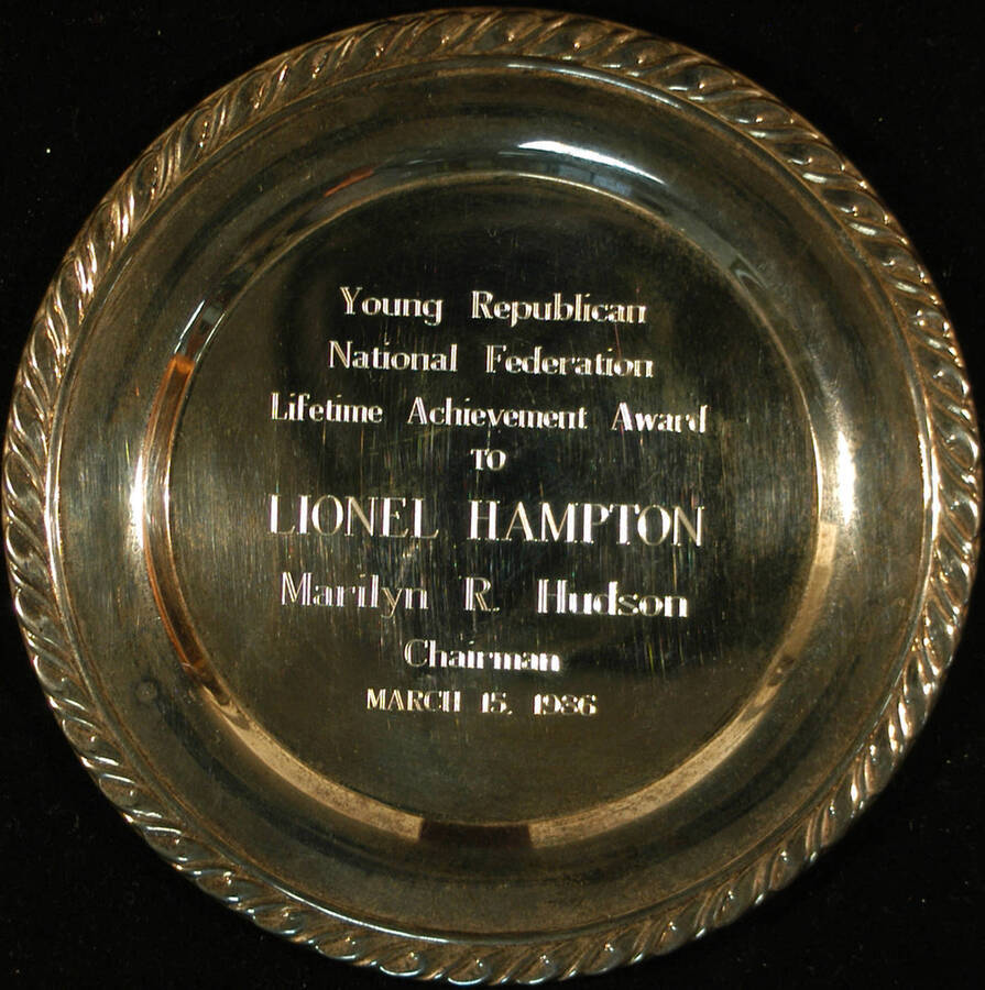Tray. 7 3/4" Silver Oneida engraved tray Young Republican National Federation Lifetime Achievement Award presented to Lionel Hampton. Marilyn R. Hudson, Chairman. Mar. 15, 1986