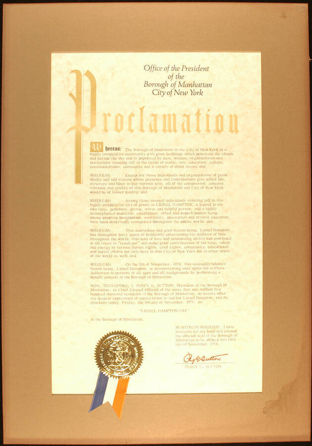 Framed Certificate. 20"x14" Proclamation with gold foil seal and red, blue, and white ribbon in gray mat Borough of Manhattan proclaims November 5, 1976 as Lionel Hampton Day. Percy E. Sutton, President. New York, NY, Nov. 5, 1976