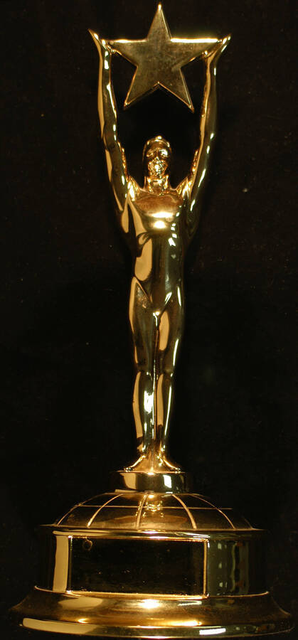 Trophy. 14 1/2"x6 1/2" Gold figure holding a star above its head