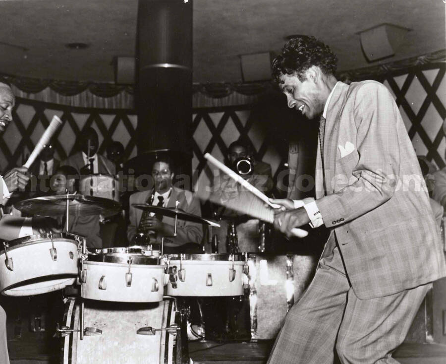 8 x 10 inch photograph. Lionel Hampton and Curly Hamner playing the drums