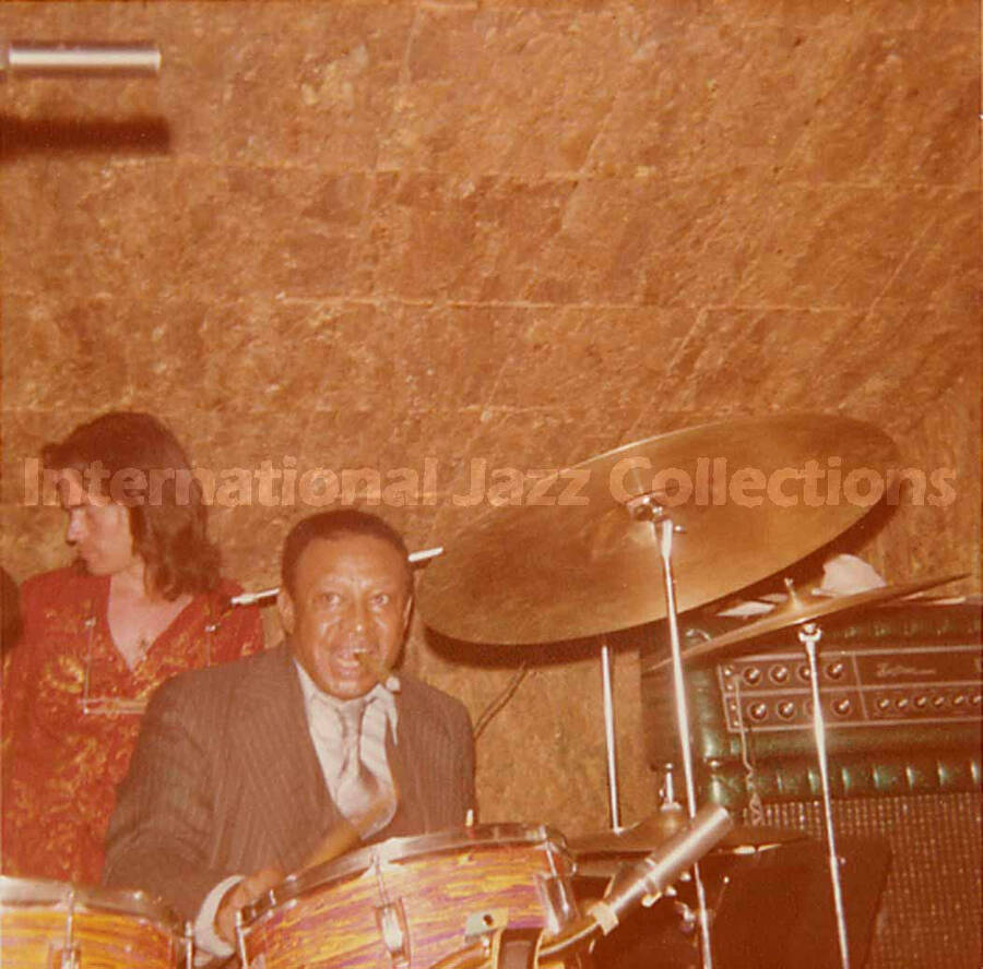 3 1/2 x 3 1/2 inch photograph. Lionel Hampton playing the drums [in Lucerne, Switzerland?]