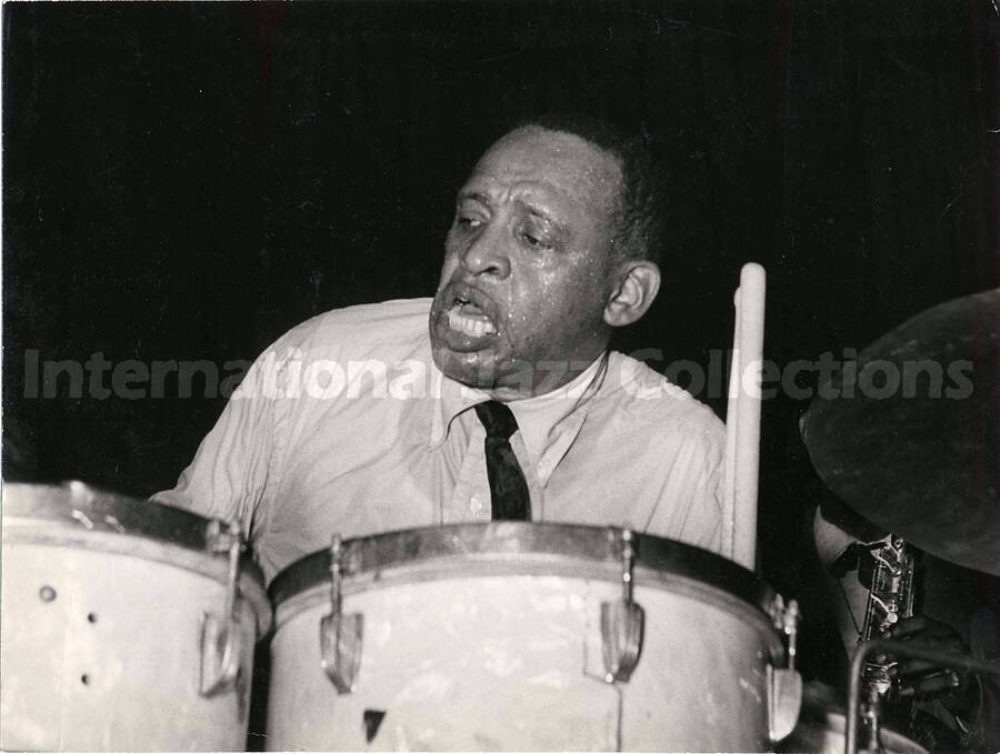 7 x 9 inch photograph. Lionel Hampton playing the drums