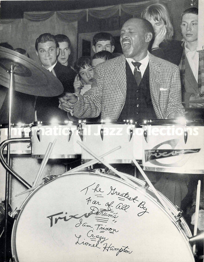 10 1/2 x 8 1/2 inch photograph. Lionel Hampton playing Trixon drums, in Germany