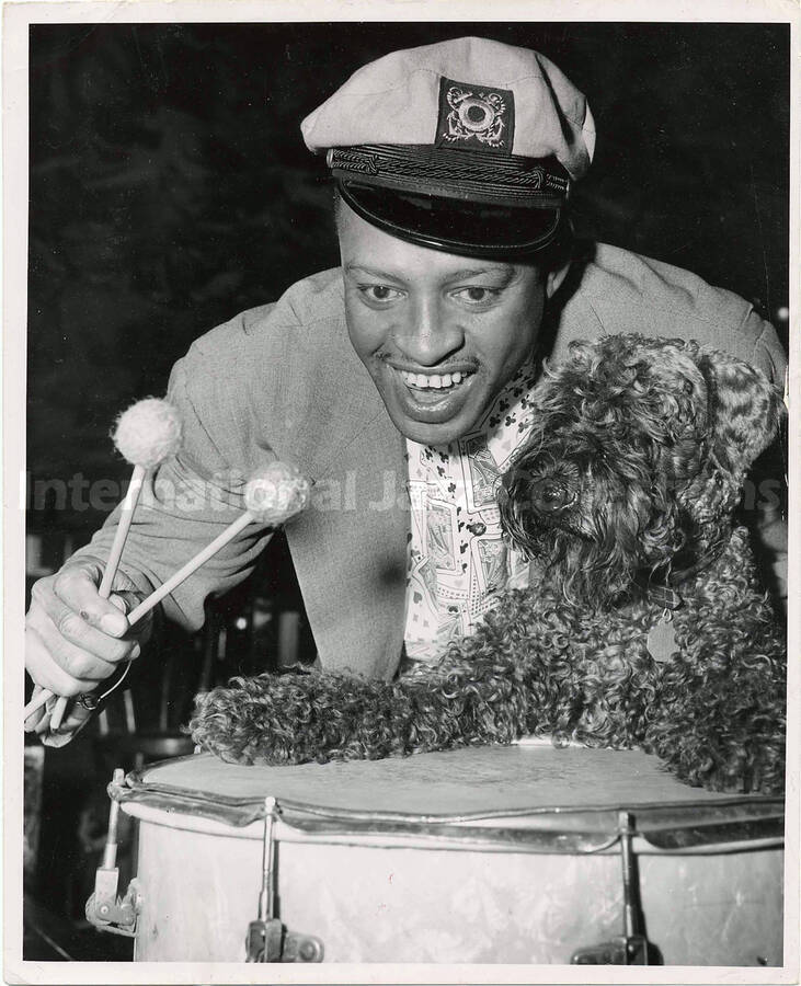 10 x 8 inch photograph. Lionel Hampton on drums with his dog