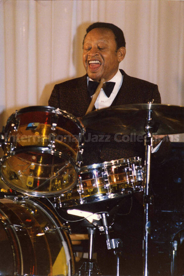 12 x 8 inch photograph. Lionel Hampton playing the drums