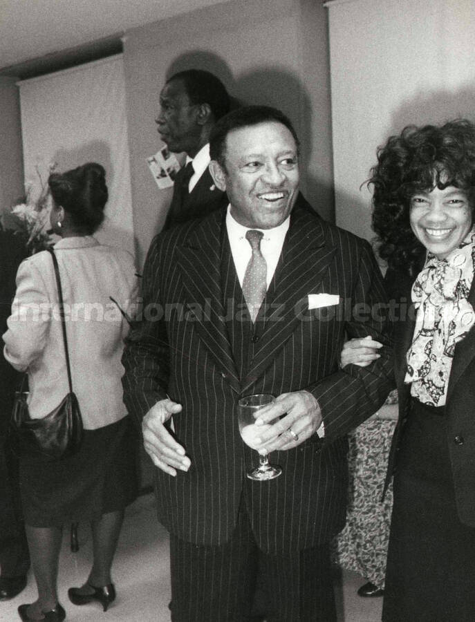 10 x 8 inch photograph. Lionel Hampton with unidentified woman on the occasion of his Birthday party