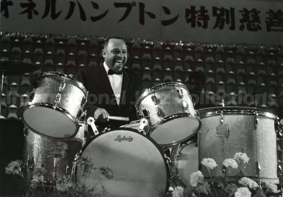 4 1/2 x 6 inch photograph. Lionel Hampton performing on the drums [in Japan?]