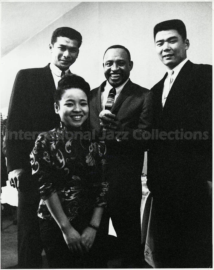 10 x 8 inch photograph. Lionel Hampton unidentified persons in Japan