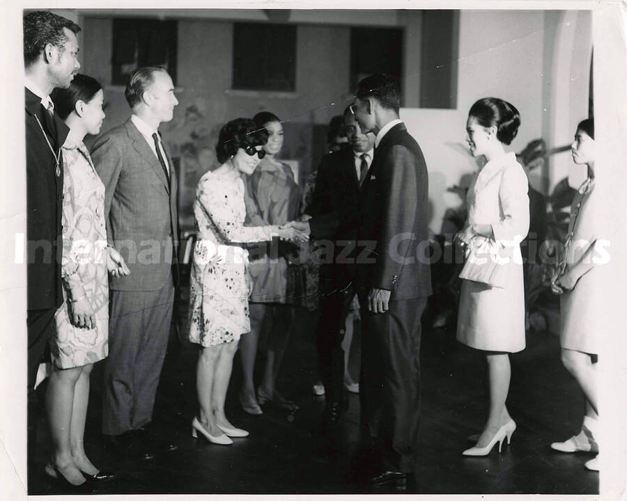 8 x 10 inch photograph. Lionel Hampton at a reception [in Thailand?]