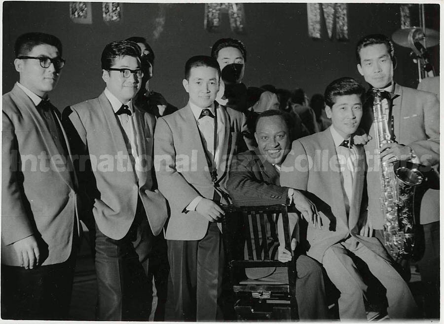 4 1/2 x 6 1/2 inch photograph. Lionel Hampton with unidentified musicians [in Japan?]