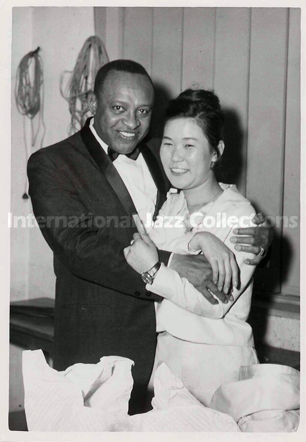 7 x 5 inch photograph. Lionel Hampton with unidentified woman, [in Japan]