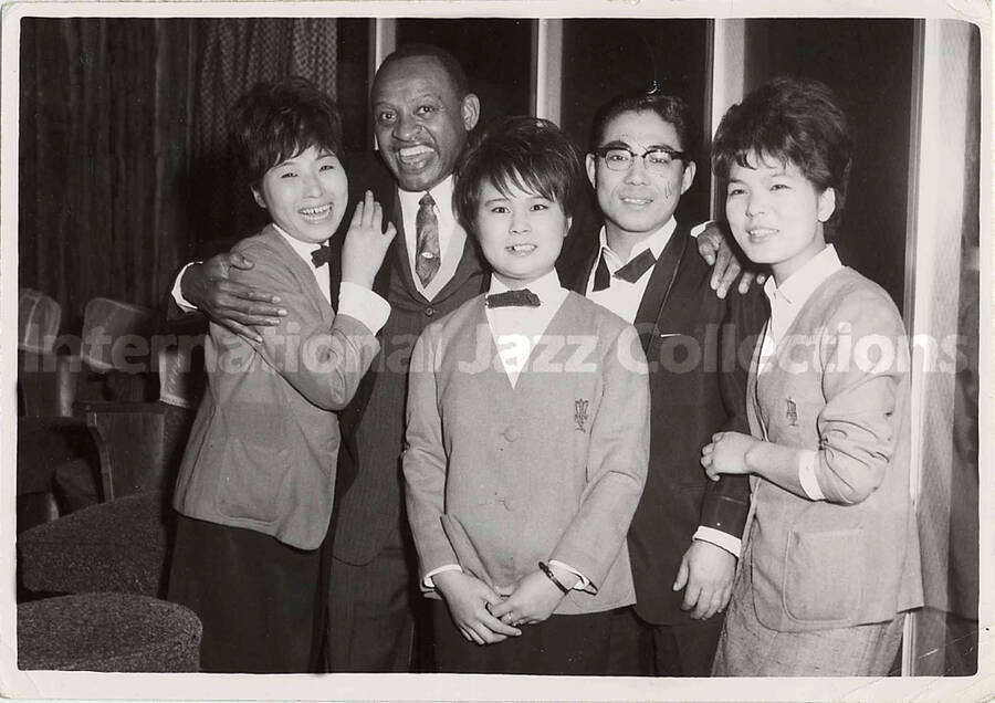 5 x 7 inch photograph. Hampton with fans [in Japan]