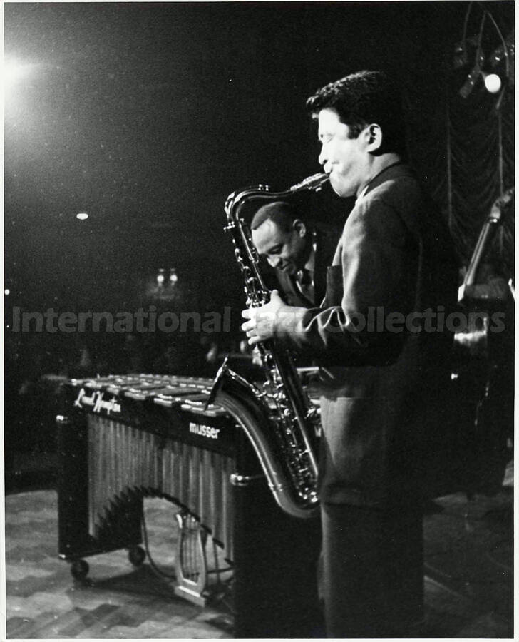10 x 8 inch photograph. Lionel Hampton performing on the vibraphone accompanied by an unidentified saxophonist [in Japan]