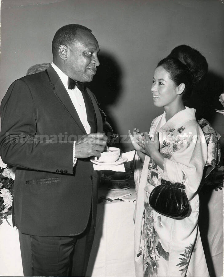 10 x 8 inch photograph. Lionel Hampton with unidentified woman dressed in Japanese costume [Yukari Kuroda?]