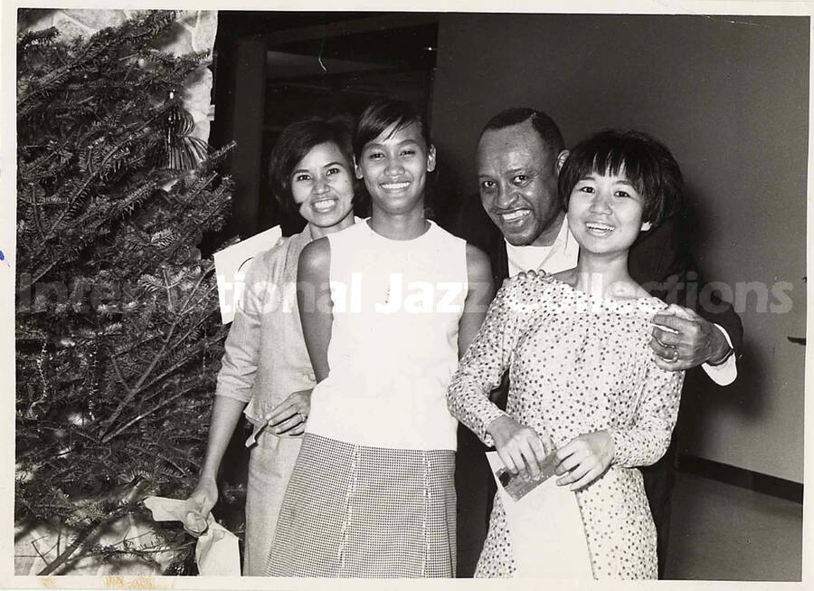 5 x 7 inch photograph. Lionel Hampton with fans in Bangkok, Thailand. Illegible dedications on the back of this  photograph
