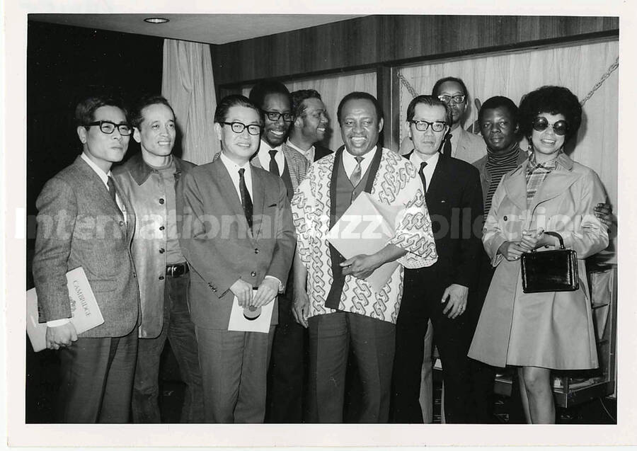 5 x 7 inch photograph. Lionel Hampton with unidentified persons in Tokyo, Japan