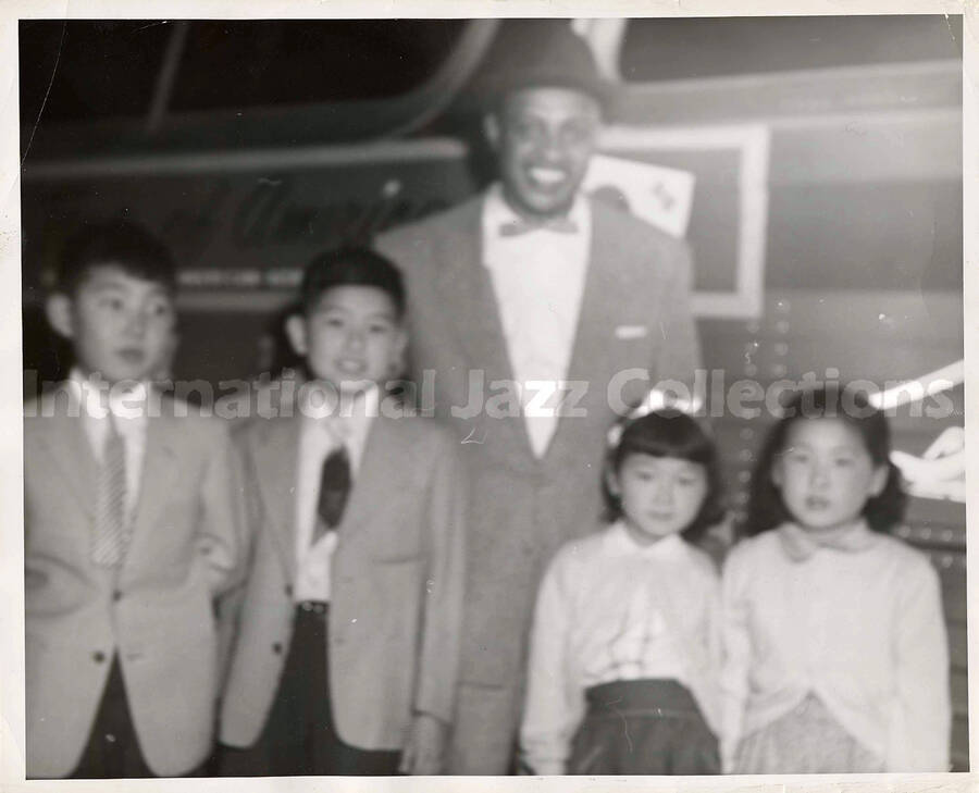 8 x 10 inch photograph. Lionel Hampton posing with children [in Japan?]