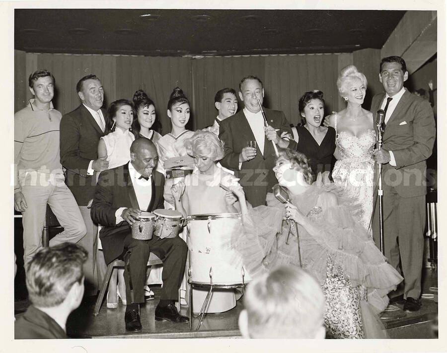 7 x 9 inch photograph. Lionel Hampton on a stage with unidentified persons, including Dean Martin and Joe E. Lewis