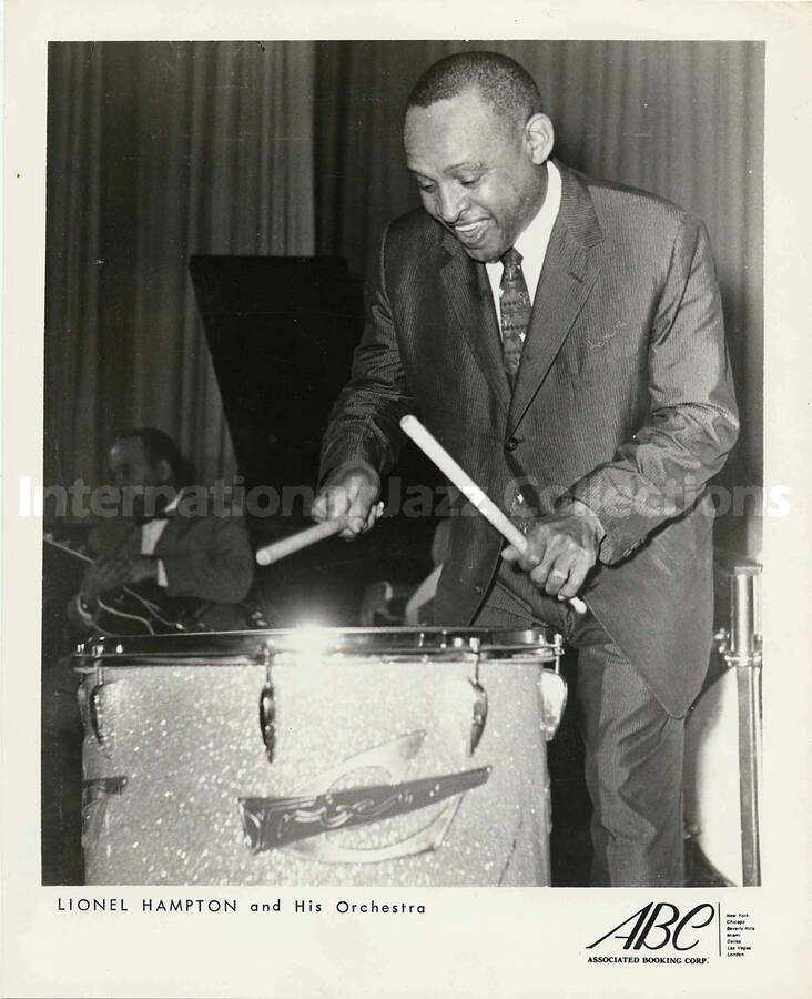 10 x 8 inch promotional photograph. Lionel Hampton playing Trixon drums. Inscribed at the bottom of the photograph: Lionel Hampton and His Orchestra