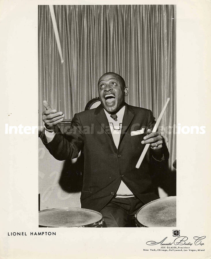 10 x 8 inch promotional photograph. Lionel Hampton playing the drums