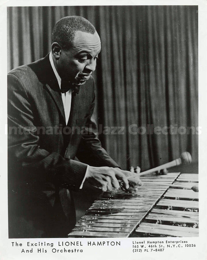 10 x 8 inch promotional photograph. Lionel Hampton playing the vibraphone. Inscribed at the bottom of the photograph: The Exciting Lionel Hampton and His Orchestra
