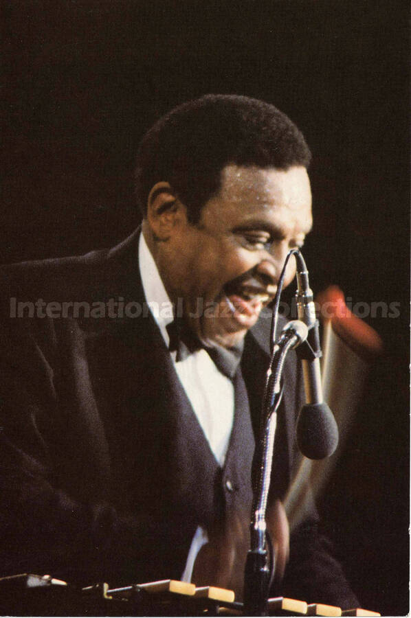 9 x 6 inch promotional photograph in the format of postcard. Lionel Hampton. Printed on the back: Lionel Hampton; The Good Will Ambassador of Jazz; Keep Swinging