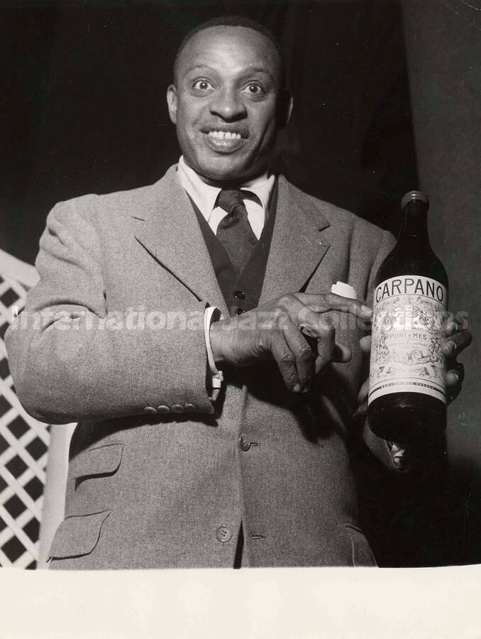 9 1/2 x 7 inch photograph. Lionel Hampton poses for Carpano vermouth, in Italy