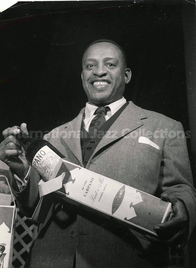 9 1/2 x 7 inch photograph. Lionel Hampton poses for Carpano vermouth, in Italy