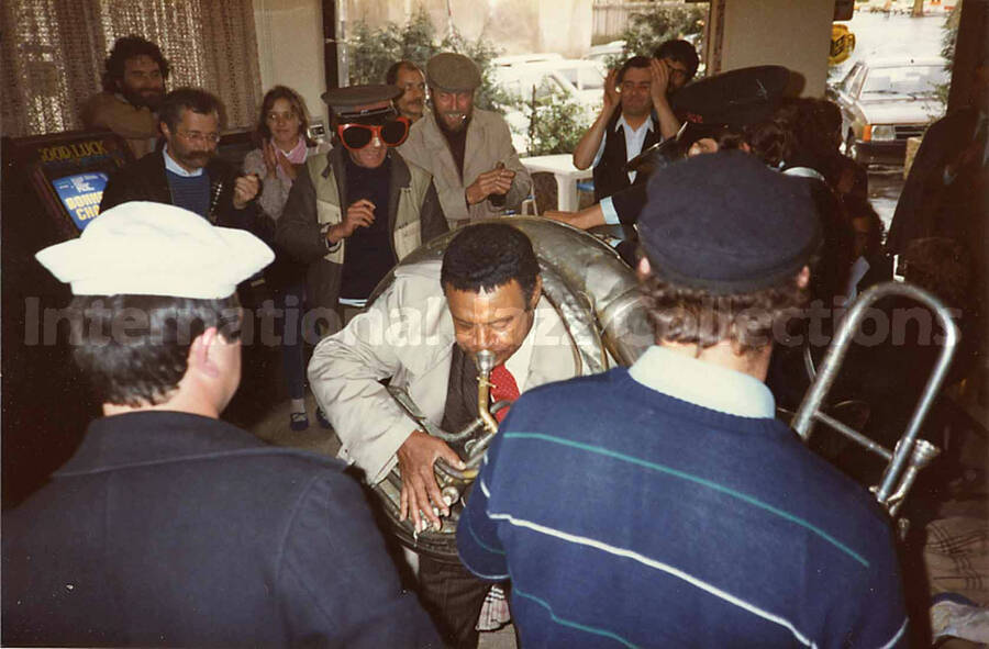 3 1/2 x 5 1/2 inch photograph. Lionel Hampton with the band Les Buccinateurs Reunis in a restaurant in [Bordeaux], France
