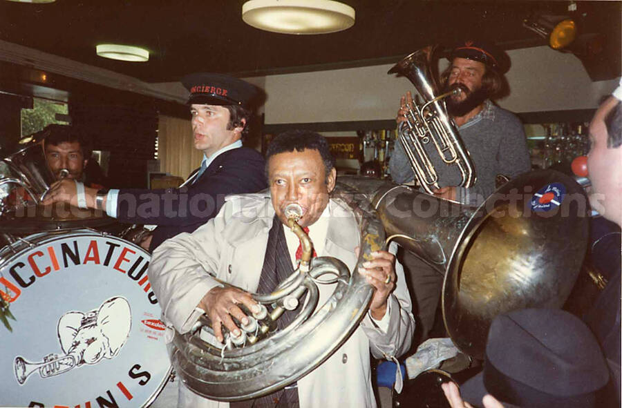 3 1/2 x 5 1/2 inch photograph. Lionel Hampton with the band Les Buccinateurs Reunis in a restaurant in [Bordeaux], France