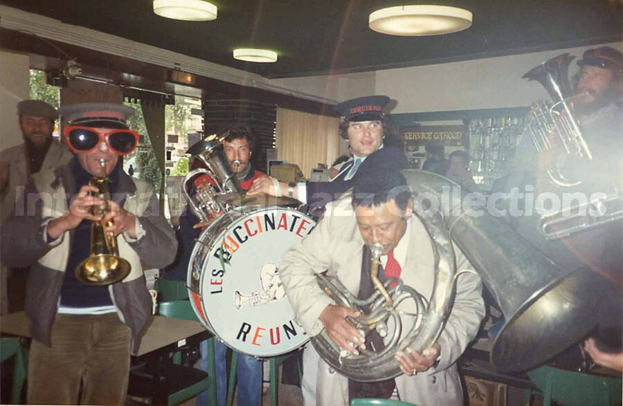 3 1/2 x 5 1/2 inch photograph. Lionel Hampton with the band Les Buccinateurs Reunis in a restaurant in [Bordeaux], France