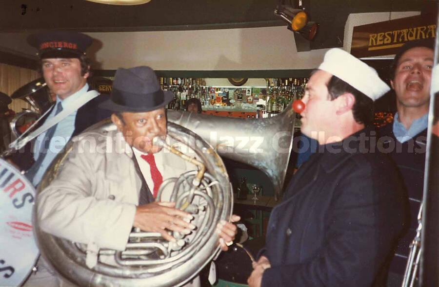 3 1/2 x 5 1/2 inch photograph. Lionel Hampton with the band Les Buccinateurs Reunis in a restaurant in [Bordeaux], France