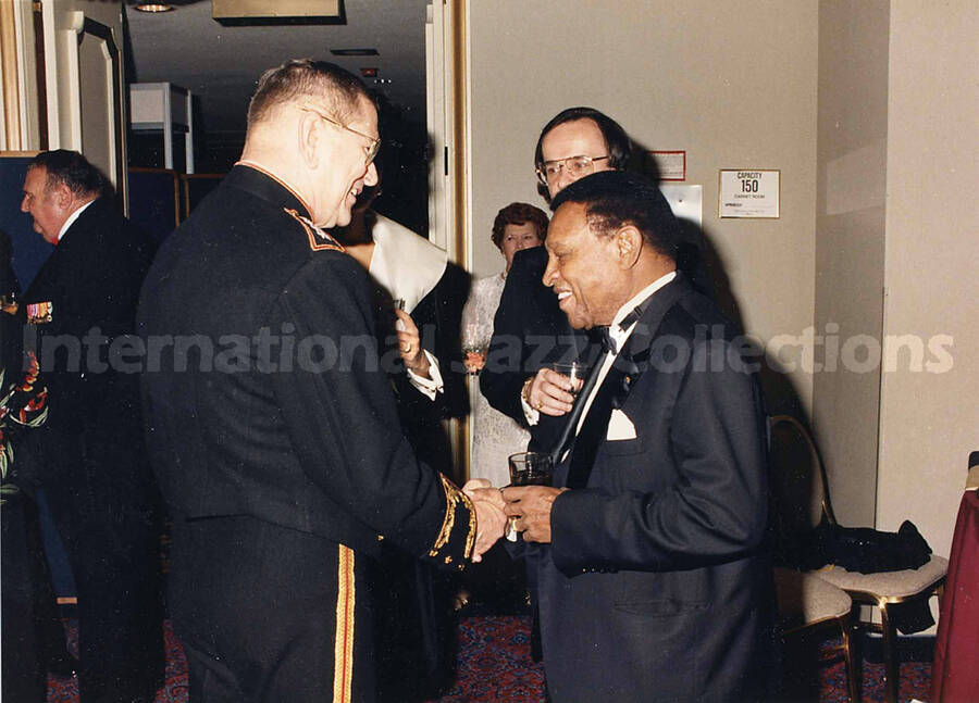 5 x 7 inch photograph. Lionel Hampton on the occasion of the 214th Marine Corps Officers' Ball with CMC at the Washington Hilton