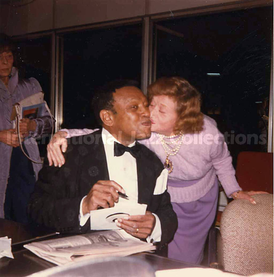 3 1/2 x 3 1/2 inch photograph. Lionel Hampton with unidentified woman