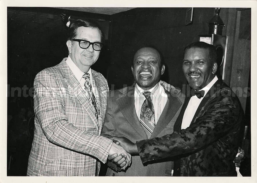 5 x 7 inch photograph. Lionel Hampton with two unidentified men