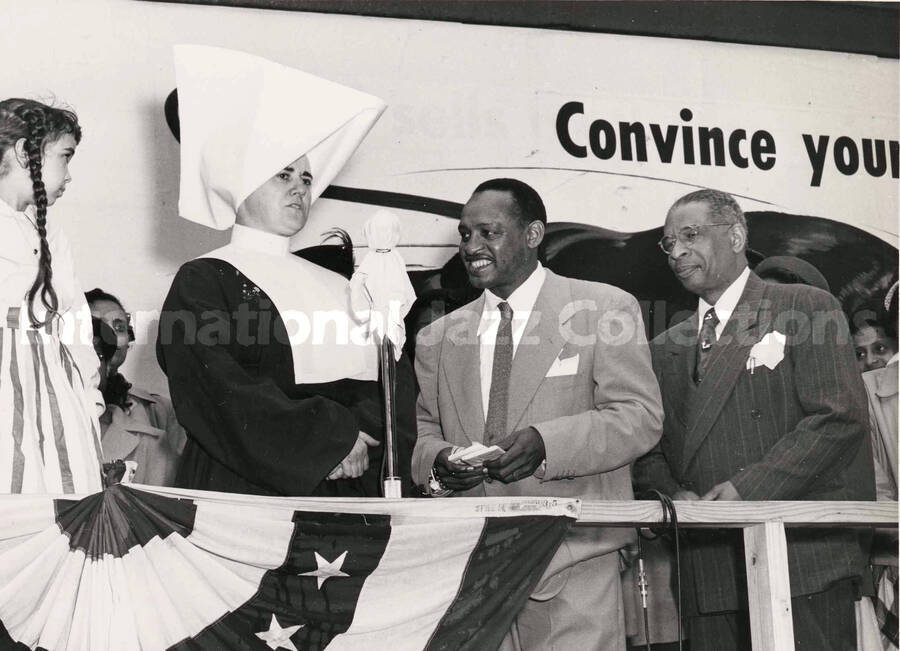 8 x 10 inch photograph. Lionel Hampton with unidentified persons, including a catholic nun