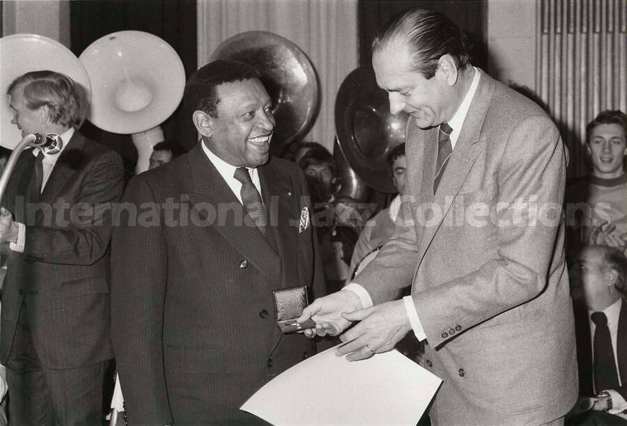 6 1/2 x 9 1/2 inch photograph.  Lionel Hampton receives the medal of the City of Paris from the Jacques Chirac, Mayor of the city