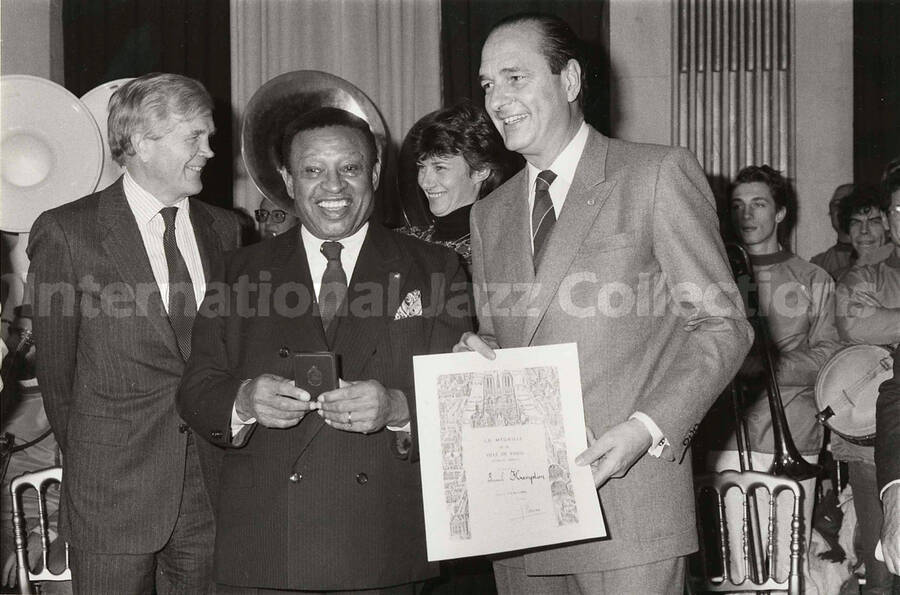 6 1/2 x 9 1/2 inch photograph.  Lionel Hampton receives the medal of the City of Paris from Jacques Chirac, Mayor of the city