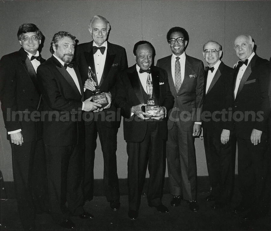 8 x 10 inch photograph. Lionel Hampton with unidentified men on the occasion of his receiving the Lifetime Achievement Award of B'nai B'rith, at the Sheraton Centre in New York
