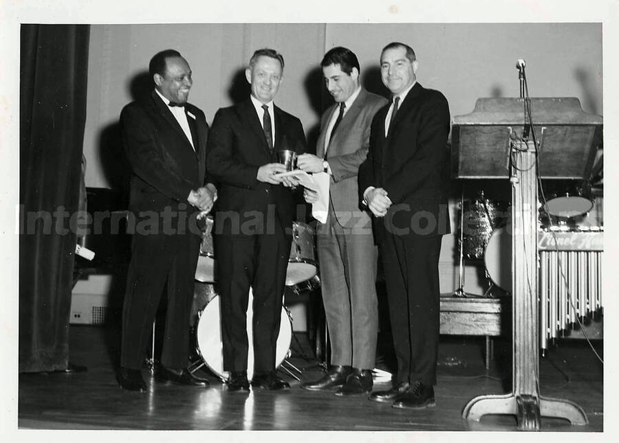 5 x 7 inch photograph. Lionel Hampton with unidentified men. New York, NY