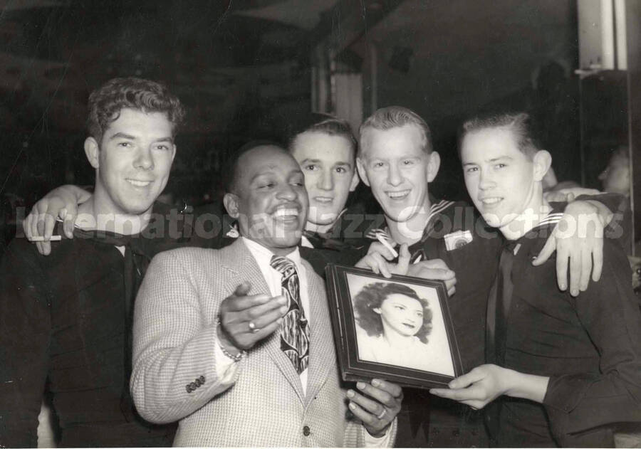 5 x 7 inch photograph. Lionel Hampton with four U.S. Navy personnel in crackerjacks