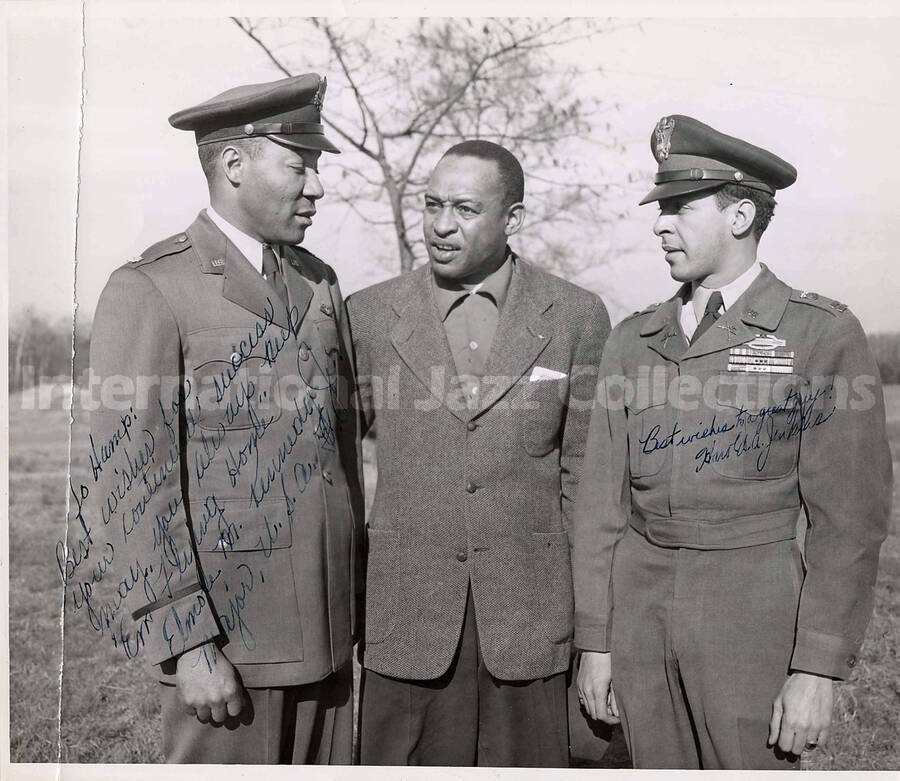 8 x 10 inch photograph. Lionel Hampton with Major Elmore M. Kennedy Jr. and another US military, Harold A. Jenkins