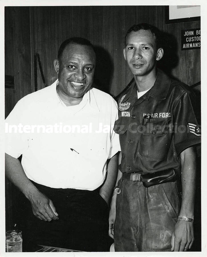 10 x 8 inch photograph. Lionel Hampton with an U.S. Air Force sergeant [at an U.S. Air Force base abroad?]. Handwritten on the back of the photograph: Skip Watson Jr., Chicago