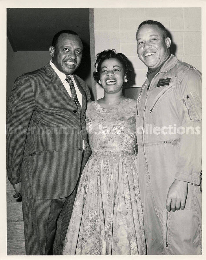 10 x 8 inch photograph. Lionel Hampton with U.S. Air Force major Clarence N. Driver and an unidentified woman