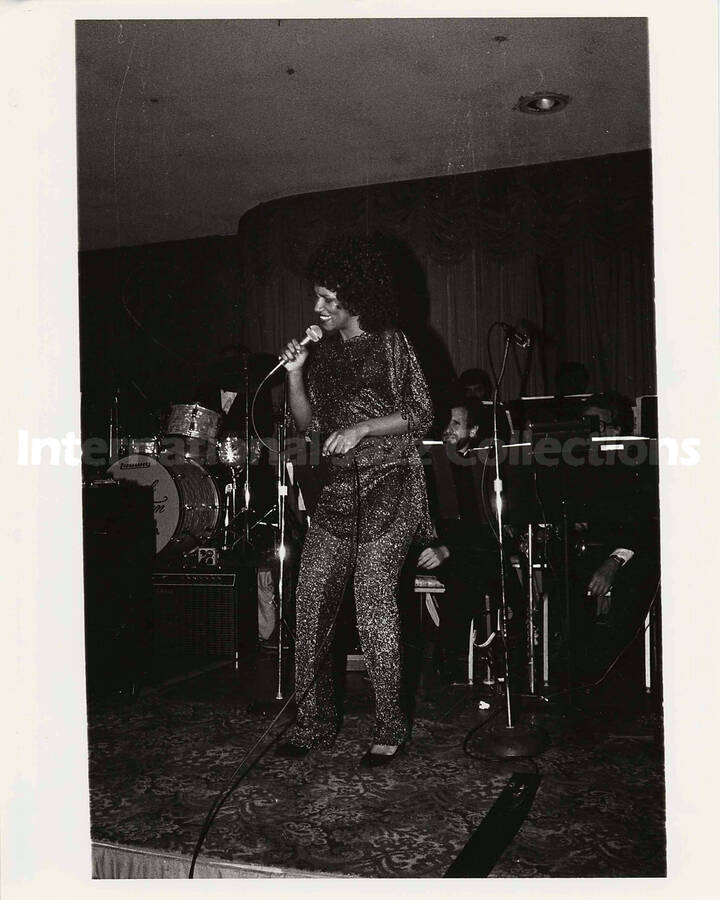 10 x 8 inch photograph. Unidentified vocalist performing with Lionel Hampton's orchestra