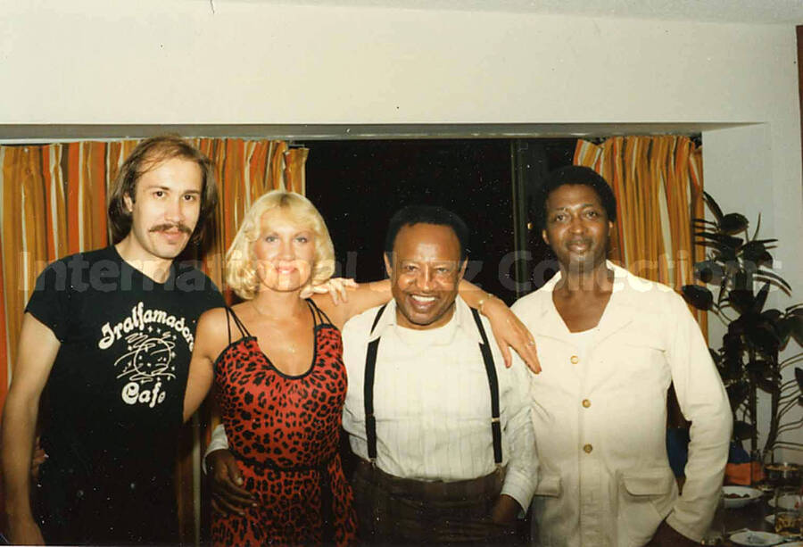 3 1/2 x 5 inch photograph. Lionel Hampton with two unidentified men and a woman