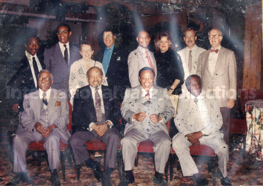 8 x 10 inch photograph. Lionel Hampton with unidentified persons. [Milt Hinton, first front row right; Doc Cheatham, fourth back row left?]