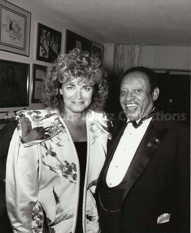 10 x 8 inch photograph. Lionel Hampton with Sylvia Bennett at a reception